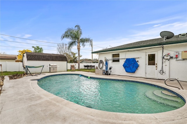 445 Virginia Ave, Saint Cloud, FL 34769 - view of swimming pool featuring a fenced backyard, a patio area, an outbuilding, and a storage unit