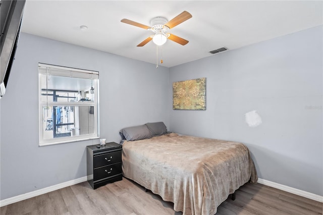 445 Virginia Ave, Saint Cloud, FL 34769 - bedroom featuring light wood-type flooring, baseboards, and ceiling fan