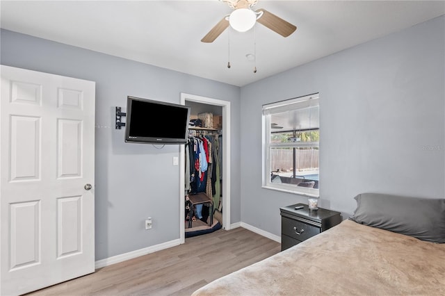 445 Virginia Ave, Saint Cloud, FL 34769 - bedroom with light wood-style floors, baseboards, a closet, and a ceiling fan