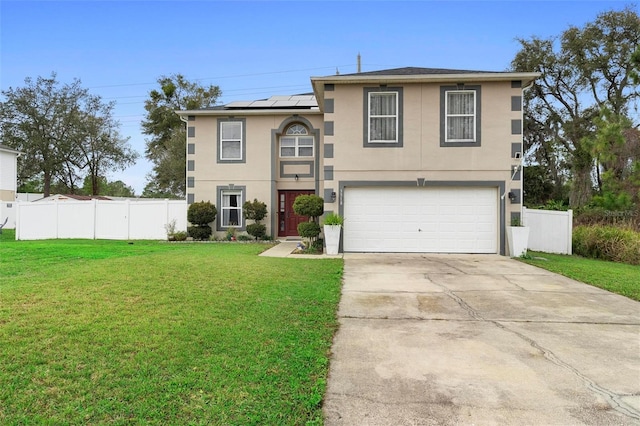 view of front of home with solar panels, a front lawn, fence, and stucco siding