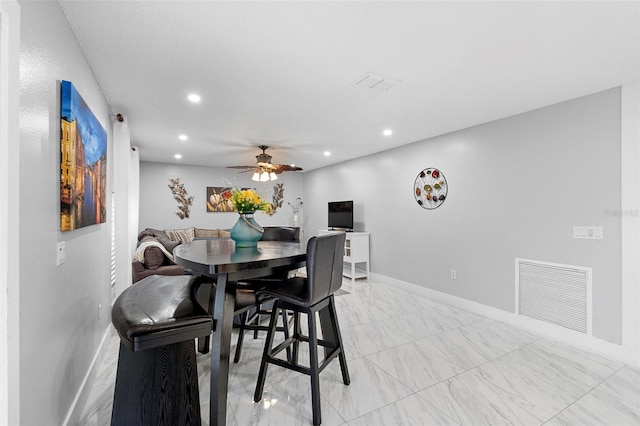 dining room with a ceiling fan, recessed lighting, visible vents, and baseboards