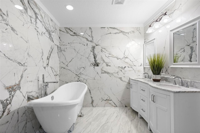 bathroom with crown molding, a soaking tub, a sink, and stone wall