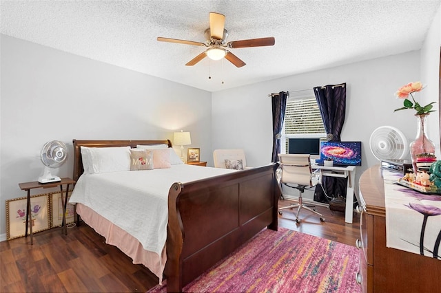 bedroom with a textured ceiling, a ceiling fan, and dark wood-type flooring