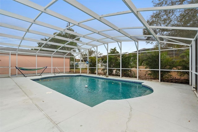 outdoor pool featuring a lanai and a patio