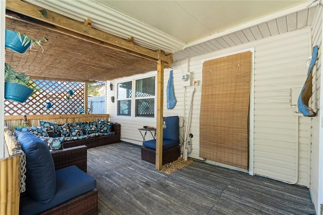 wooden terrace with outdoor lounge area