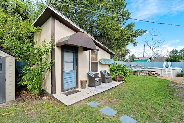 view of shed featuring a fenced in pool