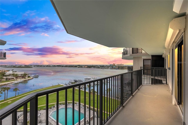 balcony at dusk with a water view