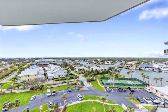 birds eye view of property with a water view