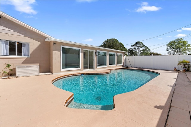 view of pool with a patio area, a fenced in pool, and fence private yard