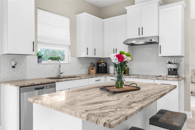 32924 Estate Garden Dr, Wesley Chapel, FL 33545 - kitchen featuring a breakfast bar, stainless steel dishwasher, white cabinets, a sink, and under cabinet range hood