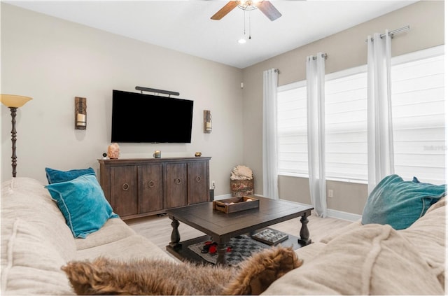 32924 Estate Garden Dr, Wesley Chapel, FL 33545 - living room with ceiling fan, light wood-type flooring, and baseboards
