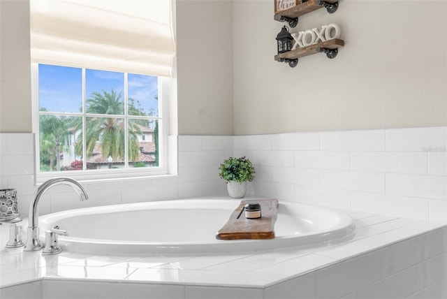 32924 Estate Garden Dr, Wesley Chapel, FL 33545 - bathroom featuring a relaxing tiled tub
