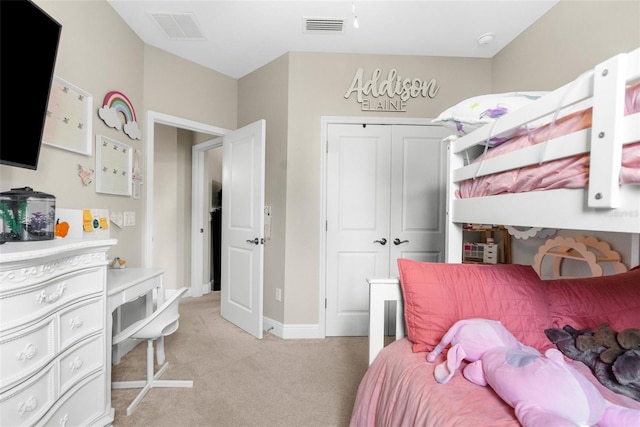 32924 Estate Garden Dr, Wesley Chapel, FL 33545 - bedroom with light colored carpet, a closet, visible vents, and baseboards