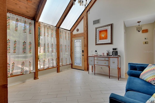 interior space featuring visible vents, an inviting chandelier, high vaulted ceiling, beamed ceiling, and baseboards