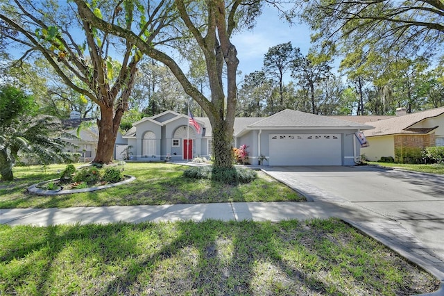 ranch-style house with concrete driveway, a front lawn, an attached garage, and stucco siding