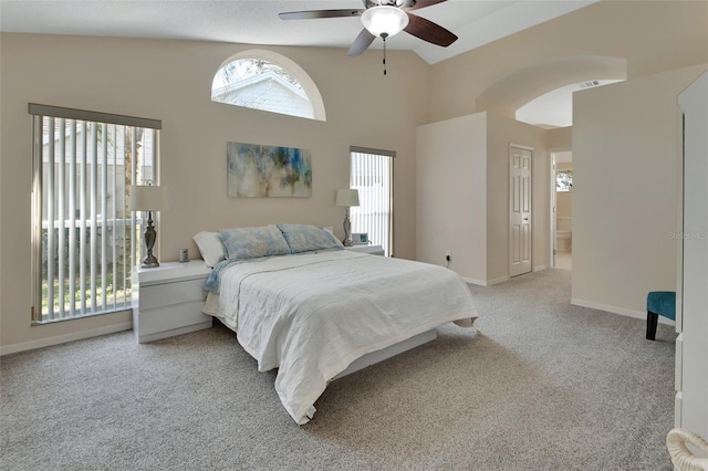 bedroom featuring high vaulted ceiling, ceiling fan, baseboards, and light colored carpet