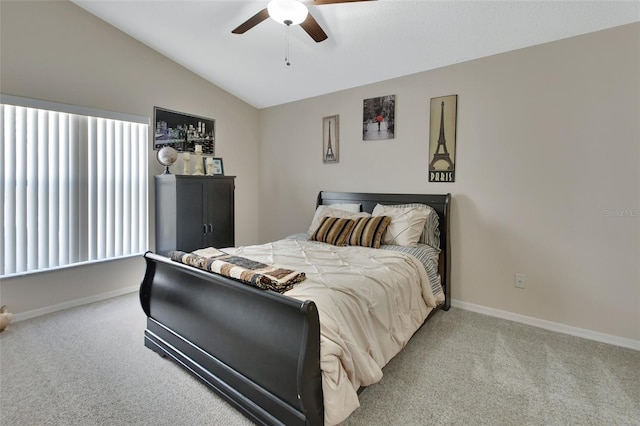 bedroom featuring light carpet, ceiling fan, lofted ceiling, and baseboards