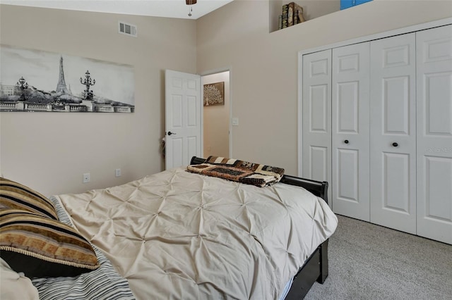 bedroom with a closet and visible vents