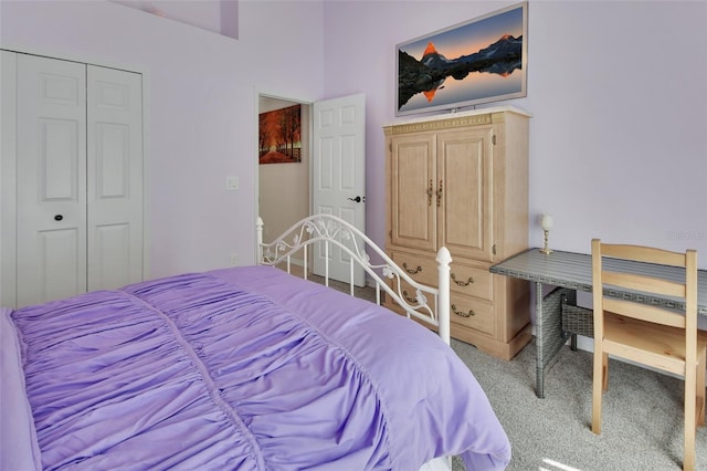 carpeted bedroom featuring a closet