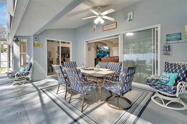 interior space with outdoor dining space and a ceiling fan