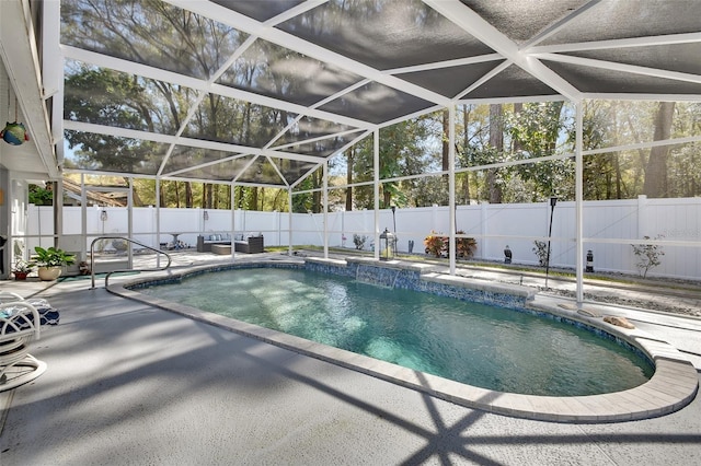 view of pool featuring a patio, a fenced backyard, a fenced in pool, and a lanai