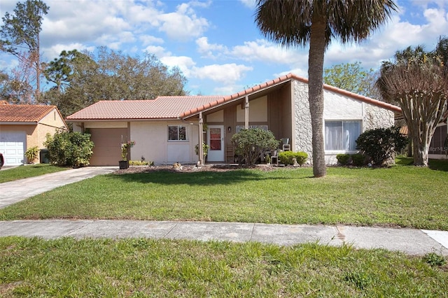 view of front of property featuring an attached garage, a front yard, and stucco siding