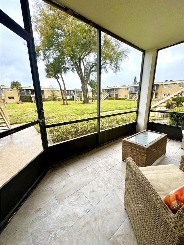 sunroom with a residential view