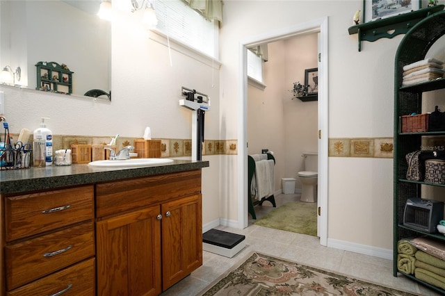 bathroom featuring toilet and vanity