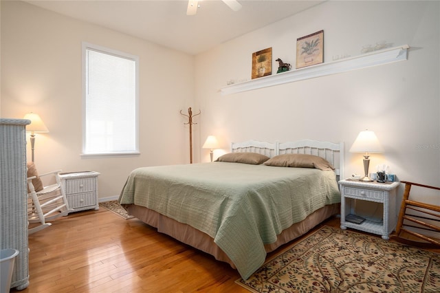 bedroom with a ceiling fan and hardwood / wood-style floors