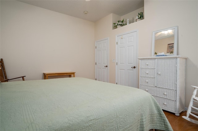 bedroom featuring wood finished floors