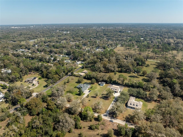 aerial view featuring a view of trees