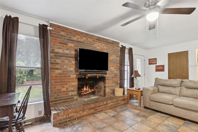 living room featuring a textured ceiling and a fireplace