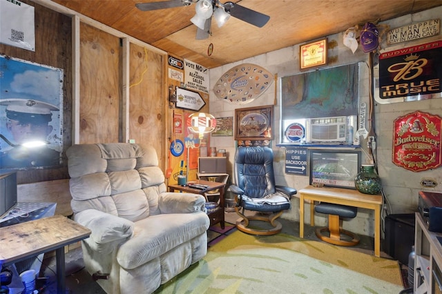 living area with wooden ceiling and ceiling fan