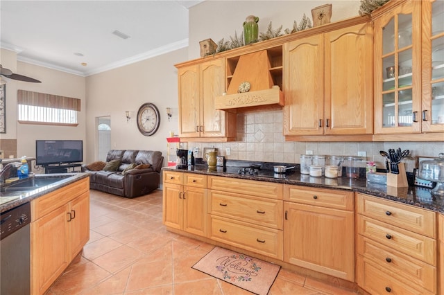 kitchen with stainless steel dishwasher, glass insert cabinets, open floor plan, a sink, and dark stone countertops