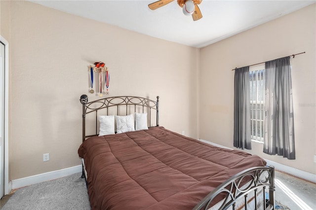 bedroom with ceiling fan and baseboards