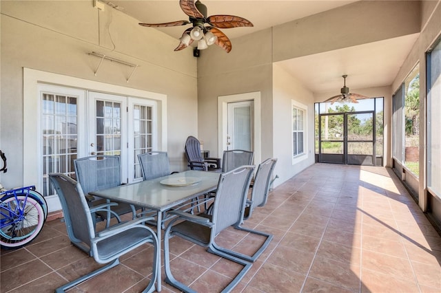 sunroom with ceiling fan and french doors