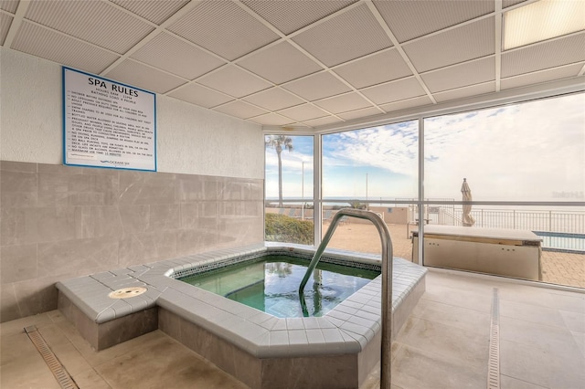 view of swimming pool featuring an indoor in ground hot tub