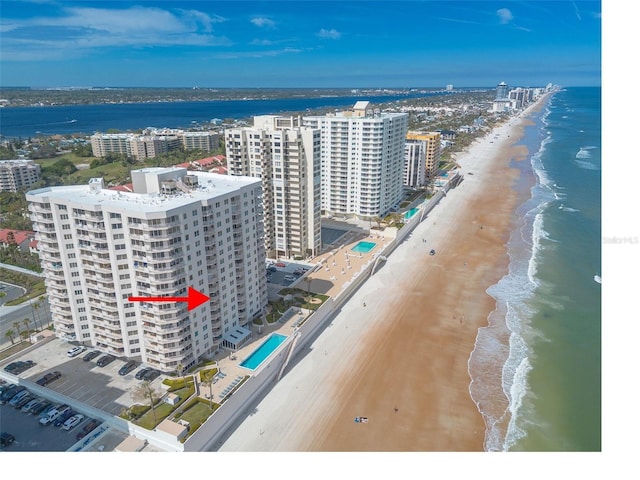 aerial view with a view of city, a beach view, and a water view