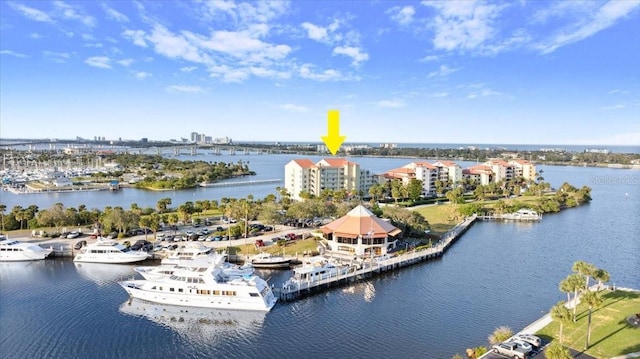 birds eye view of property featuring a water view and a city view