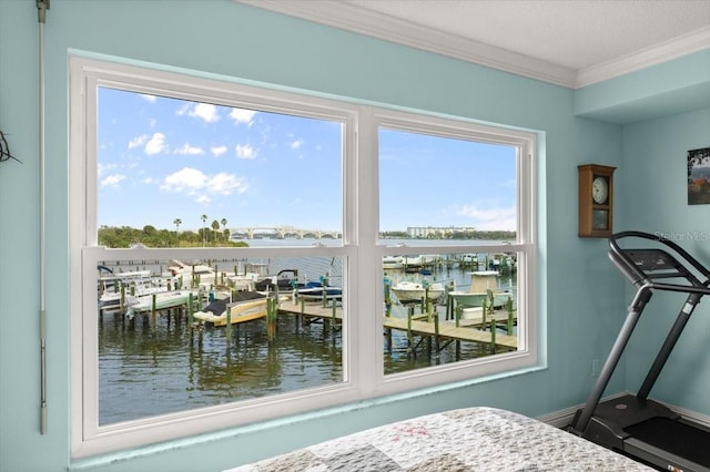 bedroom featuring a water view, a textured ceiling, baseboards, and crown molding