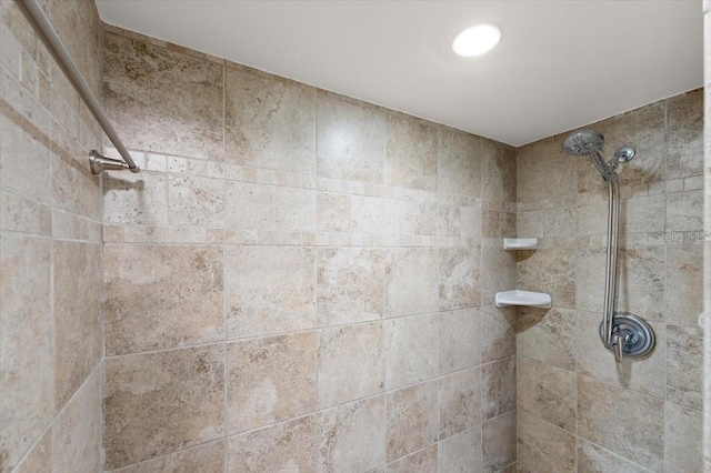 bathroom with a tile shower