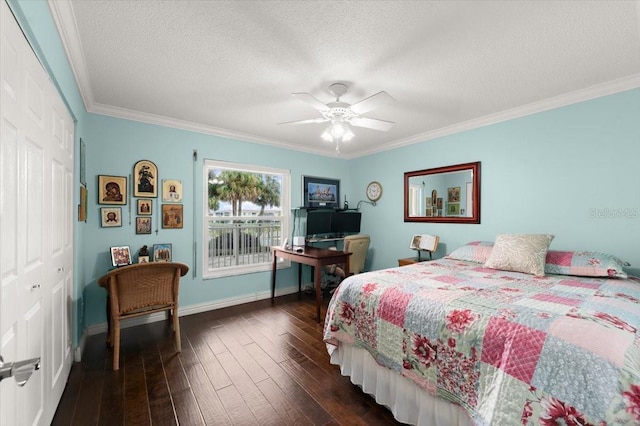 bedroom with a closet, dark wood-type flooring, ornamental molding, a textured ceiling, and baseboards