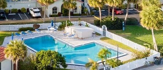 pool featuring fence private yard, a patio area, and a yard