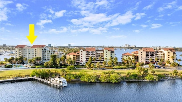 drone / aerial view with a water view and a city view