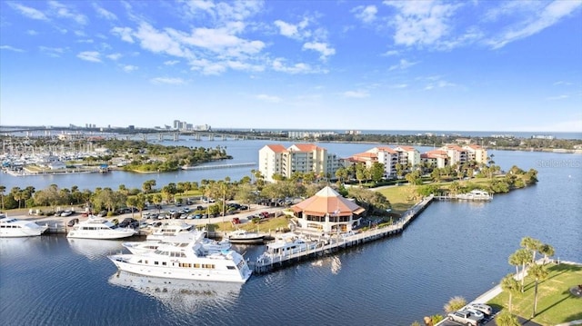 drone / aerial view featuring a water view and a city view