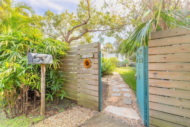 view of gate with fence