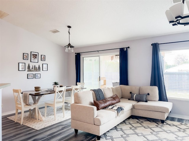 living room with a wealth of natural light and wood finished floors