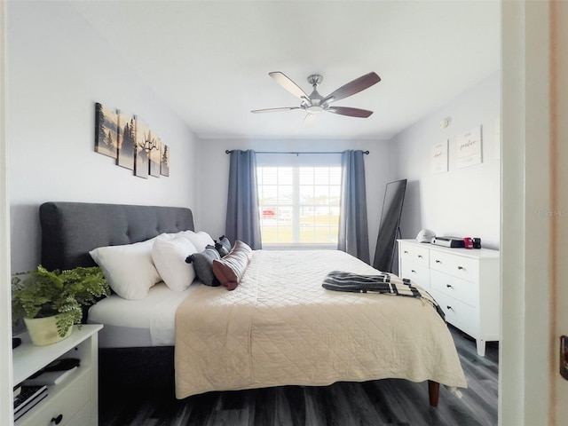 bedroom featuring dark wood-style floors and a ceiling fan