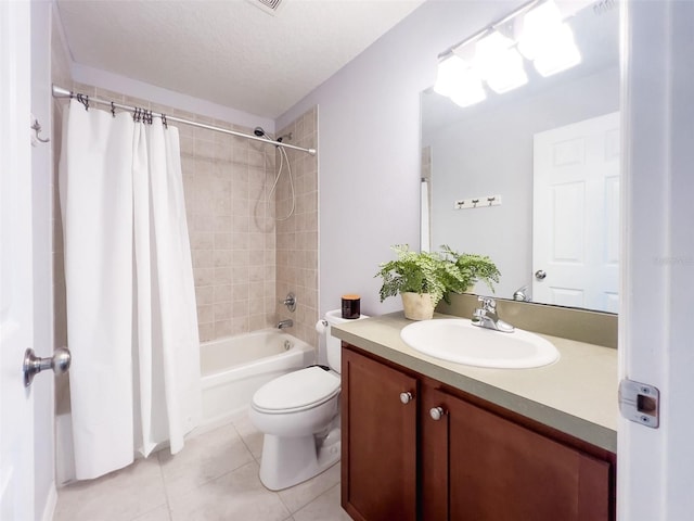 bathroom featuring toilet, shower / tub combo with curtain, tile patterned flooring, a textured ceiling, and vanity