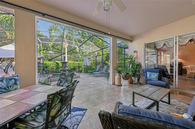 sunroom / solarium featuring vaulted ceiling and ceiling fan